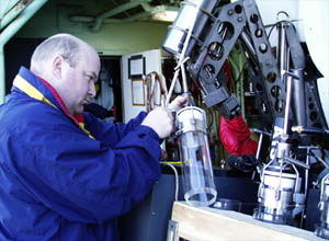 Tim Shank checks the push cores. Scientists will use these cores to sample the hydrothermal mud from the seafloor in the Guaymas Basin. 