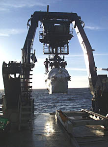  While the submersible is on the seafloor, Martial Taillefert prepares the chemical sensors that will be used the following day.  