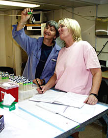  George Luther prepares chemical sensors for the next day&rsquo;s dive.  