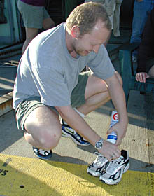 Martial Taillefert fills Brian Glazer&rsquo;s shoes with whipped cream. It is part of Brian&rsquo;s initiation for his first Alvin dive. 