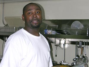 Even late at night, Ernest Stelly is working in the galley to feed all hands. (Photo K. Madin, WHOI) 