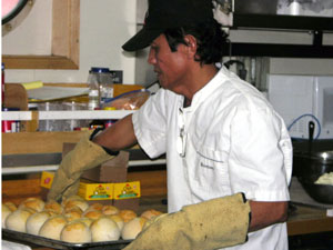 Steward Romeo Agonias bakes golden rolls for Monday&rsquo;s lunch.