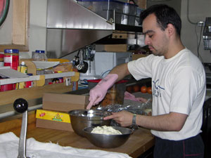 Mario Velquen works on a dessert in the galley of the Gould.