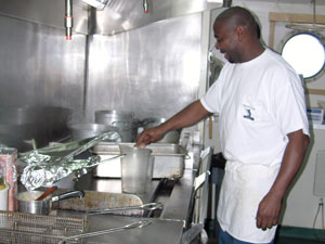 Ernest Stelly, from Texas, has worked in Antarctica for 15 years. He begins working on dinner as soon as lunch is cleared away.
