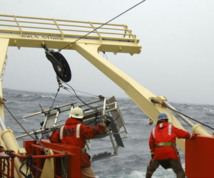 The imaging instrument LAPIS breaks the surface after being towed and pulled in by the winch. (Photo by Kate Madin, WHOI)