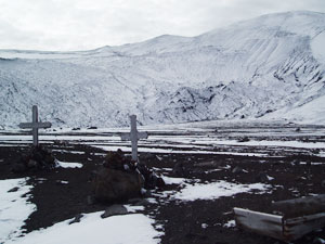 The small graveyard established by the Hektor Whaling Station in Whaler&rsquo;s Bay that was overrun by mud flows during a 1968 volcanic eruption. (Photo by Kelly Rakow, Woods Hole Oceanographic Institution)