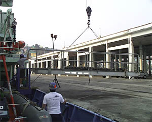 Bosun Jerry Graham directs lifting the gangplank prior to casting off. 