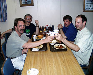 (clockwise from left) Paul Oberlander, Jim Cochran, Kevin Fisk, and Phil Forte enjoying dinner. 