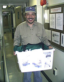  Dana demonstrates the first rule of doing laundry at sea - be sure to return the basket.  