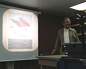  Dr. Dana Yoerger gives the afternoon talk on his research with the ABE (Autonomous Benthic Explorer). ABE is an autonomous robot, meaning that it is put in the water and is pre-programmed to go and do detailed surveys on the ocean floor, without any tether to the surface or people inside. ABE represents the wave of the future in deep submergence technologies. Dana and his colleagues at Woods Hole Oceanographic, Dr. Al Bradley and Mr. Barrie Walden, are working on the next generation of ABE which they plan to have ready by next year. 
