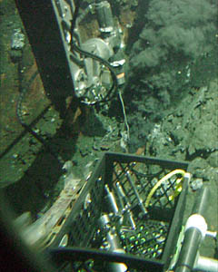 Alvin's manipulator is holding the high-temperature probe to measure how hot the fluid exiting the vent is. The temperature of this vent, P Vent, is 376 &deg; Celsius.