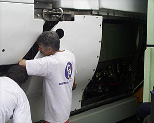 Dan Fornari helps the Alvin crew remove the "skins" of the sub so that all the equipment can be washed and checked in preparation for the next Alvin diving cruise. 