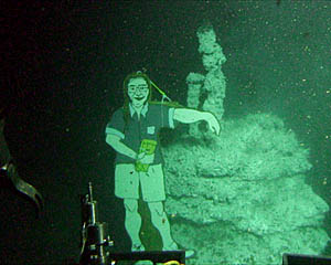 Plywood Dave Olds on the seafloor by "Dave" vent at 2509 meters depth in the Axial Summit Trough of the East Pacific Rise crest. Distance across the bottom of the photo is about 4 meters. 