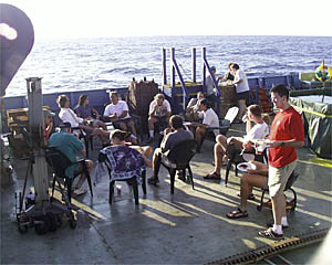 The science party, Atlantis, and Alvin crews mingle at the barbeque on the fantail.