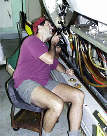 Bruce Strickrott checking the equipment on Alvin as part of the post-cruise maintenance program.