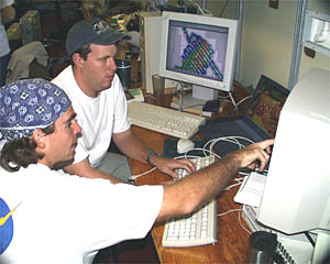 Greg Kurras and Paul Johnson set up a computer database that lets scientists compare pictures of the seafloor (previously collected) with sidescan sonar “images” of the seafloor (which will be collected starting tomorrow). By matching sonar signals with actual pictures, they will be able to see how the sonar can detect different types of lava terrain.