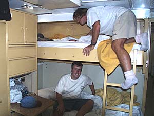 Do you think they ever make their beds? Greg Kurras (top) and Paul Johnson in their cabin.