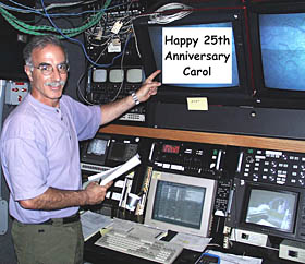 Argo II is lowered over the stern of R/V Melville for the first time on this expedition. Even though the weather is terrific and the seas are calm, we are still on a ship that rolls gently. Argo II weighs over 6000 pounds and so it has to be very carefully controlled when it is lifted off the deck so that it does not start swinging and cause damage. To do this, several people tend “safety lines” that are attached to the frame of Argo II to keep it steady. In this photo, Argo II is safely lowered over the side, and Rob Palomares (left) and Ron Comer continue to tend their safety lines while Randy Dickau is removing another of the safety lines . 