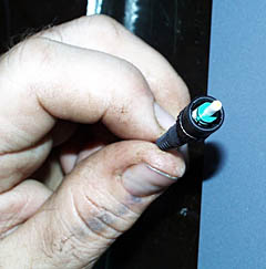 PJ Bernard is holding the optical fiber that transmits all the data from the DSL-120 sonar or Argo II system when they are being towed near the seafloor. The data have to be sent up the cable from the vehicle to the ship, through the rest of the 11,000 meters of cable that is still wound on the winch, and into the Control Van. There we see the sonar images or pictures of the seafloor. It is amazing to think of all that information being transmitted on such a tiny thread of glass! 