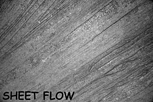 Examples of sheet lava on the East Pacific Rise crest. The distance across the bottom of the image is about 3 meters. This type of lava flows in sheets across the sea floor. 