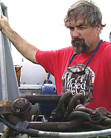 PJ Bernard stares intently at Argo II after it was brought back on board this morning. Now starts the hard work of repairing some sensors and getting Argo II ready for the next lowering. 