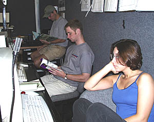 These students don’t look very busy while they are on watch in the Control Van! Clare Williams (foreground), Tim Head (middle) and Tim Haskell take a break while the ship turns around to start a new survey line. It takes about two hours, and lots of skill and patience, to turn the ship around while towing a piece of equipment on a 3500 meter-long fiber optic cable. Once back on course, these watch standers will again be busy making observations and keeping track that the data are being recorded correctly.