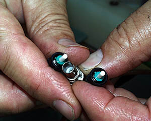 These three connectors are the “fibers” that transport the digital data and video signals from the DSL-120 or Argo II systems, through the 11,000 meters of cable on the winch, and into the Control Van where we watch the seafloor unfold beneath us. It is hard to imagine that all the data and 3 video signals get sent through such tiny wires.