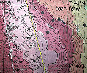 A multibeam bathymetric map produced by Uta Peckman showing the depth contours (lines of equal depth) every 10 meters, in the area bounded by 1&deg; 40’N to 1&deg; 41’N latitude and 102&deg; 16’W and 102&deg; 17’W longitude. Dan Scheirer, Scott White and Uta helped produce the navigation data for two of the three DSL-120 sonar survey lines which are shown with time marks. These maps are what we use to make preliminary interpretations of the sonar data. The black dots are the positions of some of the seismic events detected by the Autonomous Hydrophone Array. The next two slides show the DSL-120 bathymetry and the acoustic (or backscatter) image respectively of the same area of seafloor.