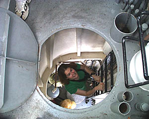 Kate Gans climbs up the ladder to the Crows Nest on R/V Melville. The Crows Nest is the top-most lookout on a ship. Capt. Buck took some of the science team for a tour of the Crows Nest today to get a great view of the ship and the beautiful blue Pacific Ocean. 