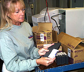 Uta Peckman carefully labels one of the hundreds of video tapes containing the recorded Argo II and DSL-120 data. On every Argo II watch, we collect six 2 hour video tapes, and 2 data tapes containing sensor and electronic still camera data. On every DSL-120 watch, we collect one sonar data tape. You can see that with so many tapes, organizing and labeling them is very important. When we get back to our labs on shore, we must be able to find everything easily. It is also important so that future scientists can use it for other experiments. Maybe someday, one of those scientists will be you! 