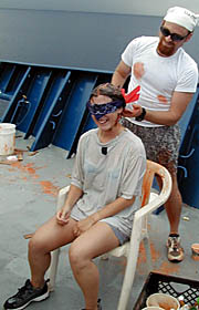 Clare Williams (aka “Glamour Pollywog”) gets a hair treatment and cut from the Royal Barber (Scott White).