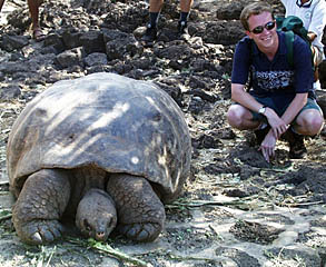 Peter Lean is all smiles as he gets close to one of the Galapagos tortoises at the Darwin Research Station.