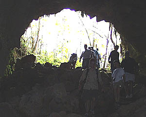 Down into the lava tube! Our intrepid explorers enter the lava tube on Santa Cruz Island that they visited yesterday. The entrance is about 10 meters across.