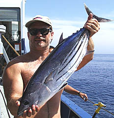 The fishing was great around Fernandina Island! Dave Murline, Melville’s First Mate, is holding an Aku tuna he caught yesterday. 