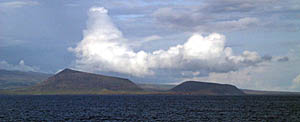 Close-up photo of the two cones on the western coast of San Salvador Island. Volcanic eruptions from the base of the slope of volcanic islands help build up the pedestal that forms the foundation of the islands.