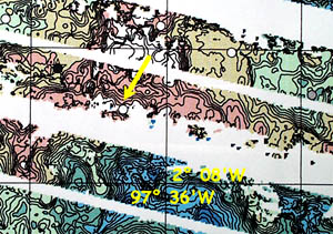 The more detailed bathymetry data that we get from the DSL-120 sonar system for the same area shown in the multibeam bathymetry maps in the previous photos. The yellow arrow points to the reflective ridge that we suspect may have young lava on it. Tonight, we will dredge to collect rocks from this feature. 