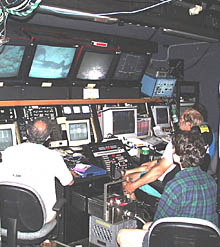 The final few hours of the last Argo II lowering! Everyone in the Control Van concentrates on the data being collected along the northern margin of the Galapagos Rift valley floor. From left to right: Mike Perfit, Maya Tolstoy, and Bob “Yogi” Elder who is flying Argo II only 8-10 meters above the seafloor.