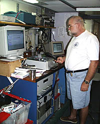 Chief Engineer Ron Wheatley checking one of R/V Melville&rsquo;s main engines.