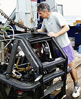 Dan checks out the equipment on the Argo II after it is brought back on board from a survey of the seafloor. 