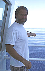 Dave takes the morning temperature readings outside the Bridge on R/V Melville. He is spinning the “sling” psychrometer, which takes a dry and wet temperature reading. The difference between the two readings allows you to calculate the humidity.