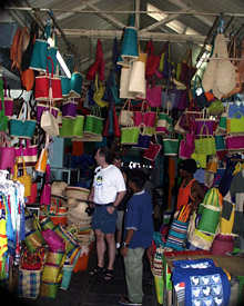 In the Port Louis market Craig Elder, a member of the Deep Submergence Operations Group, admires the selection of straw bags. Mauritius’ markets also sell model ships, Indian dresses, scarves and skirts as well as spices, from curry to vanilla.  
