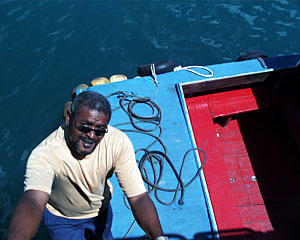 Knorr’s scientists and crew rely on water taxi driver Pierre Louis Alain for transportation from the ship across the harbor to Port Louis. Alain left school at age 12 and started driving the taxi at 13. He speaks seven languages. “I learn so many things by driving a water taxi,” says Alain. “This is where I became educated. The taxi is my window to the world.”  