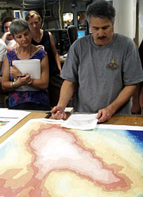 Anna-Louise Reysenbach, Dorothee Gotz and Dan Fornari review with other science team members their plans for the upcoming survey work.  