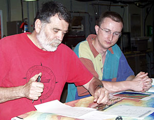 After arriving at our first research site, scientists Marvin Lilley (left) and Darryl Green plan the CTD tow yo survey that will take most of the night.  