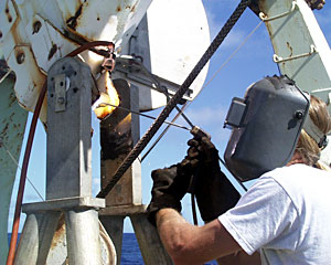 That masked man is Chief Mate Kent Sheasley, welding a part on the crane used to lower the ROV Jason into the ocean.  