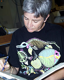 Microbiologist Anna-Louise Reysenbach notes the overnight growth of microbes she cultivated from the sulfide walls of a hydrothermal chimney sampled yesterday.  