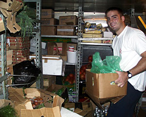Looking for 50 bottles of olive oil? How about several hundred pounds of fruit? It’s all here in the Knorr’s food store rooms. Mess Attendant Geryk Paige looks for soda - a treat for tonight’s dinner.  
