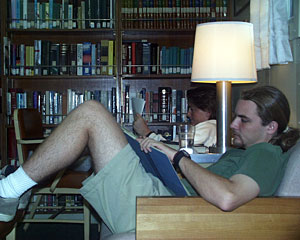  Today’s rainy afternoon provided a good chance for graduate student Robbie Young to catch up on reading in the ship’s library. 