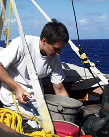 Third Assistant Engineer Piotr Marczak climbed into one of the ship’s work boats today to clean the starter switch.  