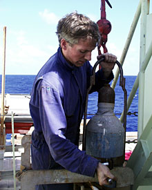 Chief Engineer Steve Walsh checks the safety clamp on an oxygen tank. The ship’s engineers sometimes use oxy-acetylene torches to weld and cut steel.  